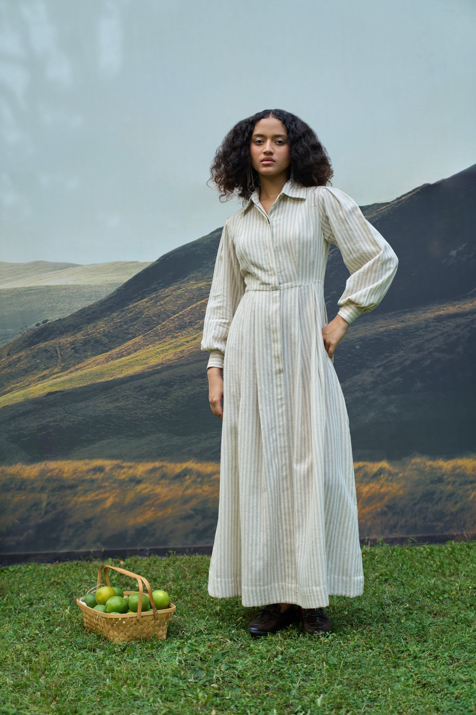 Alternative Daze maxi dress with flowing fabric and floral pattern, displayed on a hanger against a neutral background.