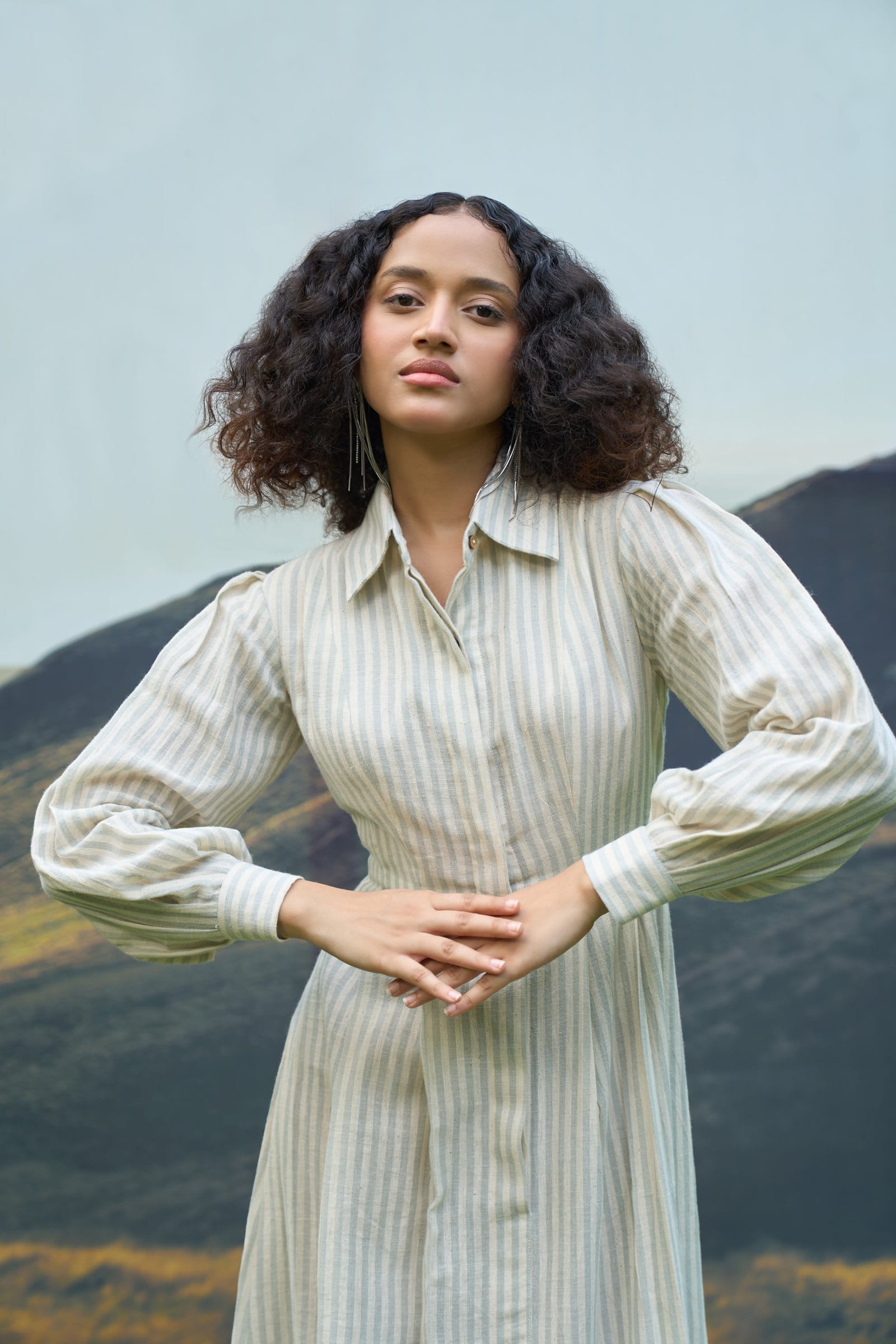 Alternative Daze maxi dress with flowing fabric and floral pattern, displayed on hanger against a plain background.