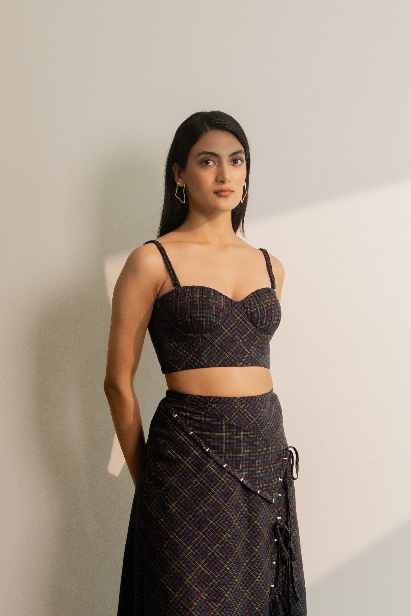 Black Prism bralette top by Alternative with colorful checkered pattern, soft fabric, and comfortable fit.
