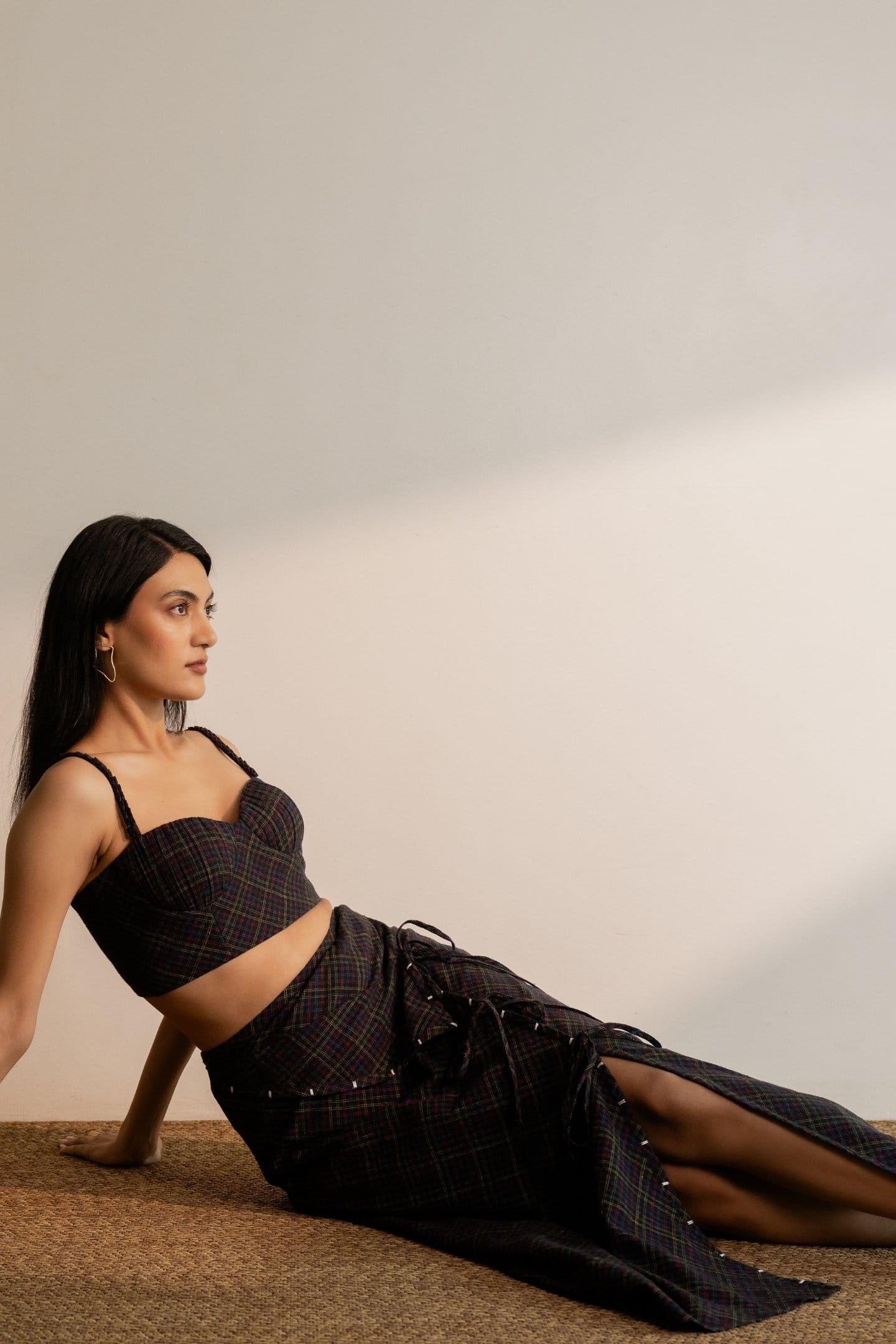 Black Prism bralette top with colorful checks, featuring a tie-up design, by Alternative, styled with a skirt.
