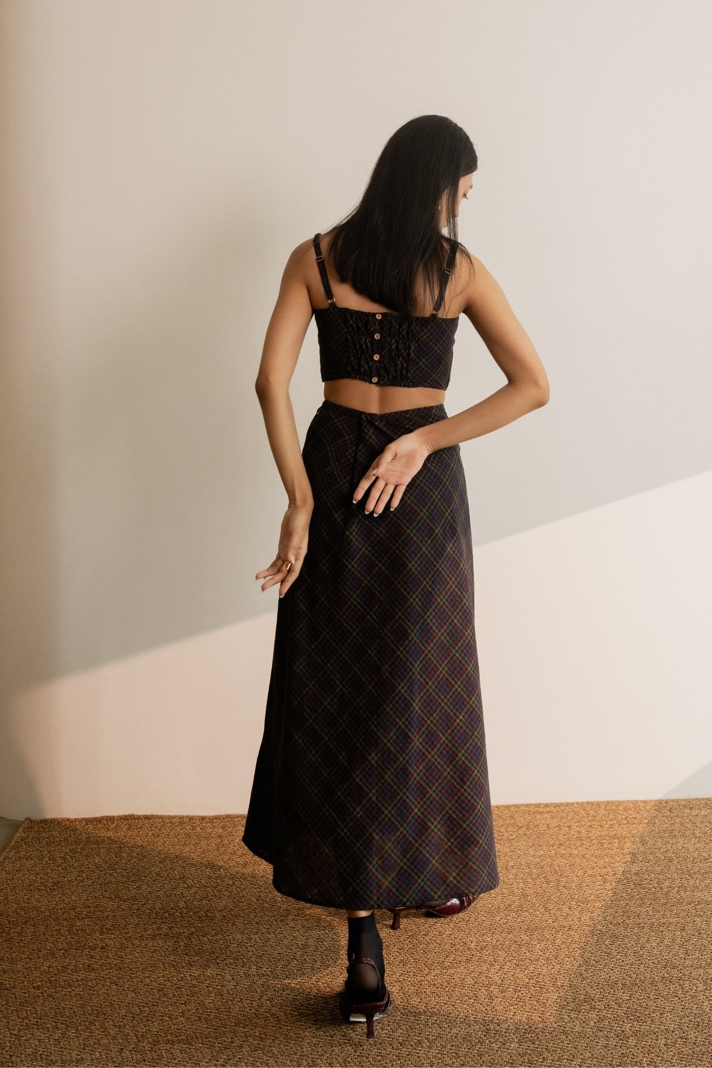 Black Prism tie-up skirt by Alternative with colorful checkered pattern and adjustable side ties, casual and stylish for everyday wear.