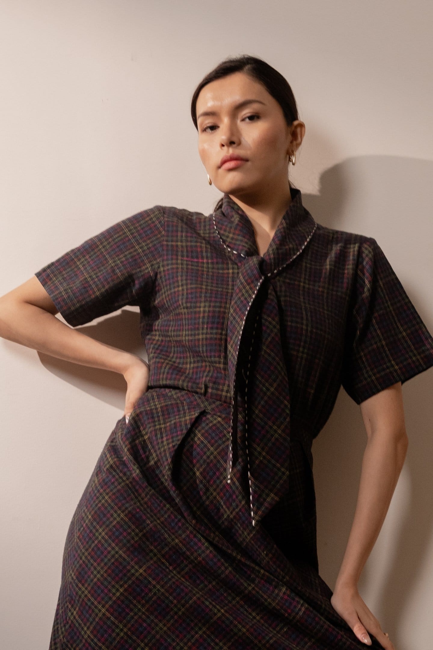 Black Prism tie-up top by Alternative featuring colorful checkered pattern and adjustable straps, casual and trendy women’s clothing.