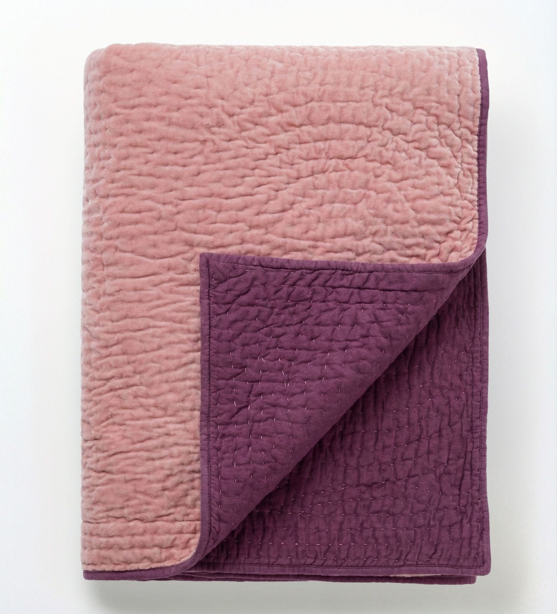 Pink velvet reversible quilt from Bombaybirds, featuring soft pink berry design and plush, cozy texture.