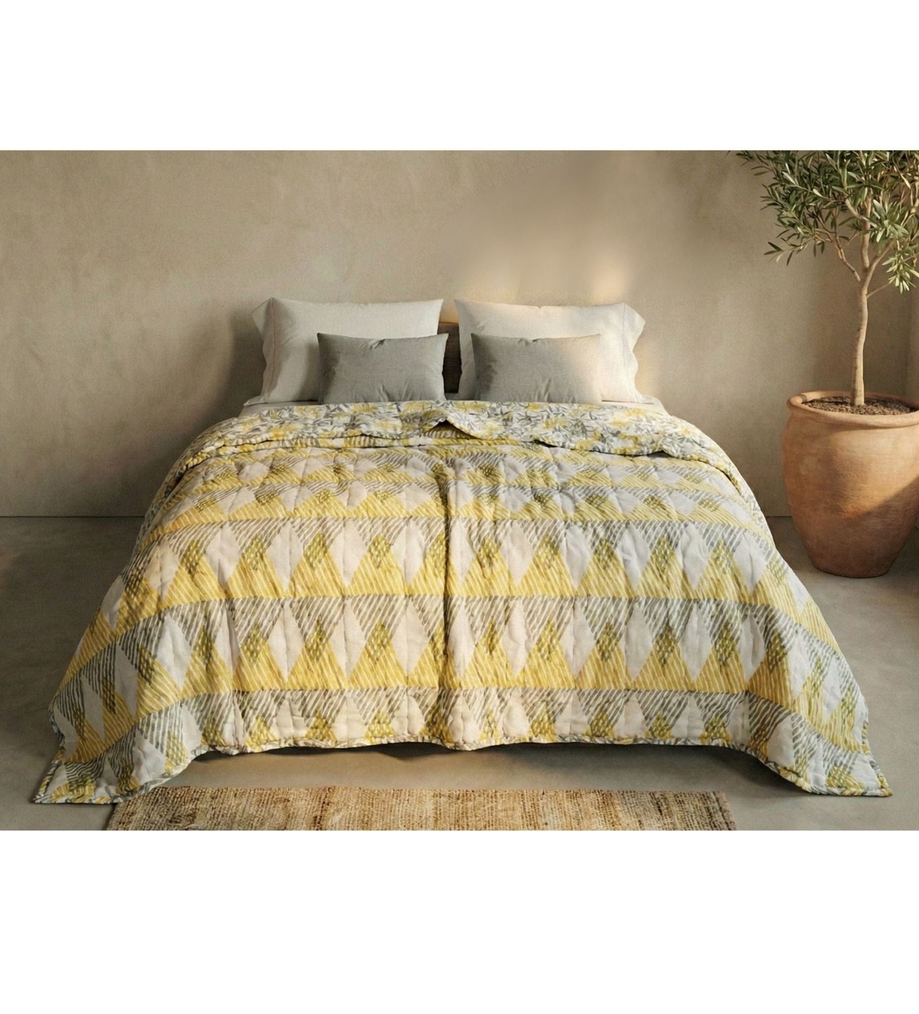 Reversible Sunnie Chintz quilt by Bombaybirds featuring vibrant yellow block print design for modern living spaces.