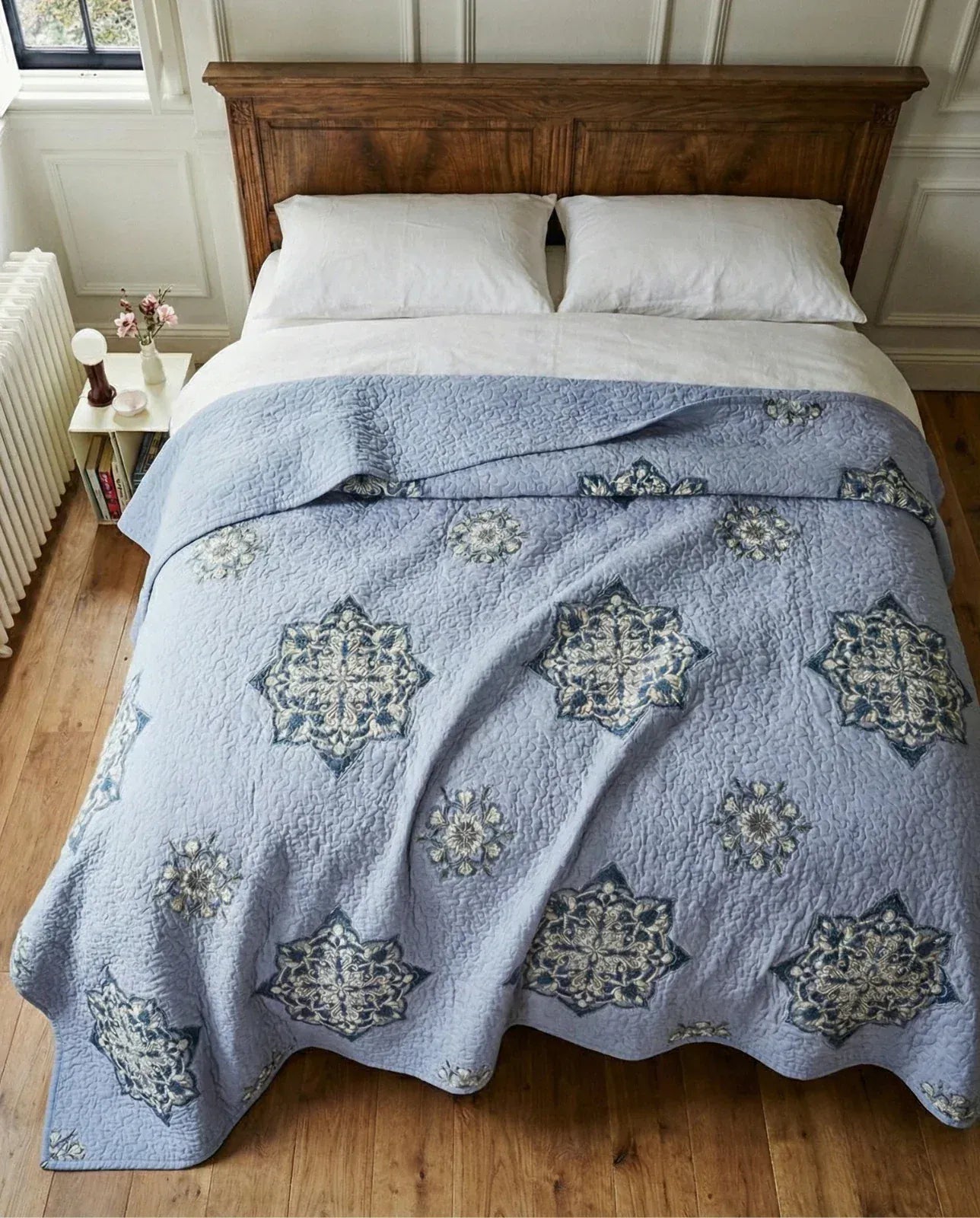 Handcrafted lilac Suzani quilt in vibrant blue and purple cotton, perfect for living room decor by Bombaybirds.