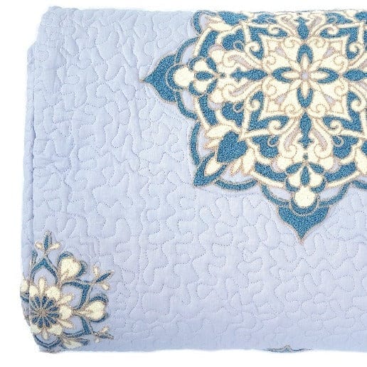 Handcrafted lilac Suzani quilt in soft cotton with intricate traditional patterns, perfect for living room decor by Bombaybirds.