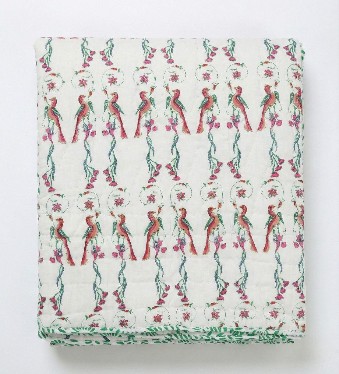 Reversible Ornitho blanket by Bombaybirds featuring bird and block print design on soft cotton, hand-finished for living room decor.